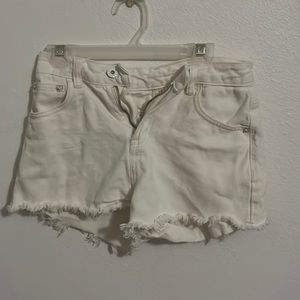 Small cute white ruffled women’s jean shorts